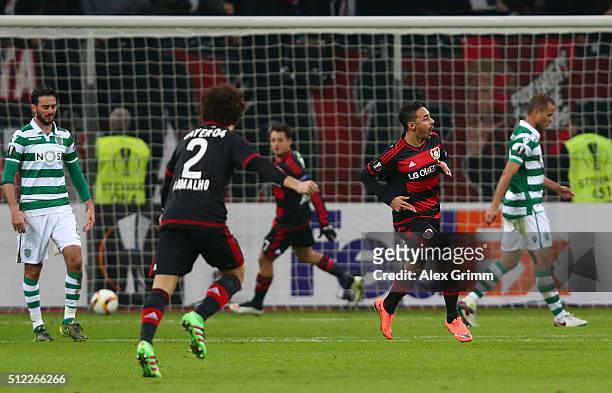 Karim Bellarabi of Bayer Leverkusen celebrates scoring his team's second goal with his team mates during the UEFA Europa League round of 32 second...