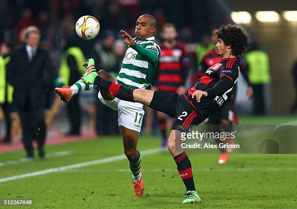 Joao Mario of Sporting Lisbon and Andre Ramalho of Bayer Leverkusen compete for the ball during the UEFA Europa League round of 32 second leg match...
