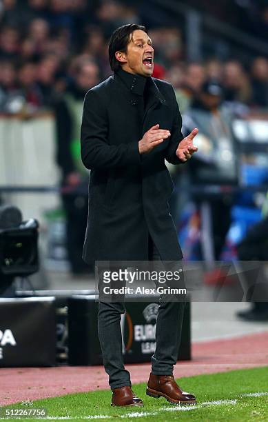 Roger Schmidt head coach of Bayer Leverkusen gestures during the UEFA Europa League round of 32 second leg match between Bayer Leverkusen and...