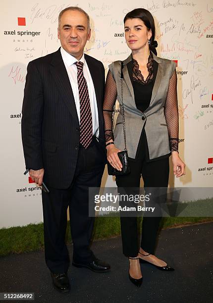 Garry Kasparov and Daria Tarasova arrive for the presentation of the first Axel Springer Award on February 25, 2016 in Berlin, Germany.