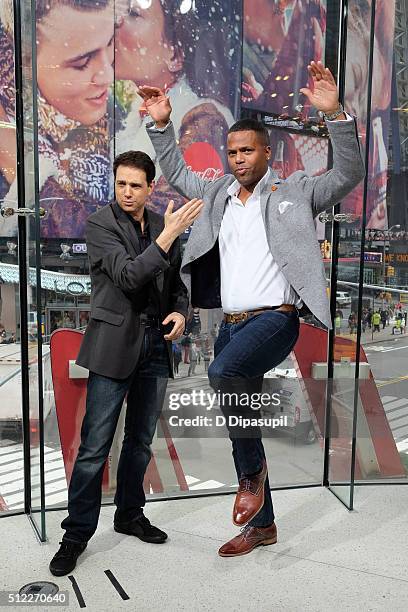 Calloway interviews Ralph Macchio during his visit to "Extra" at their New York studios at H&M in Times Square on February 25, 2016 in New York City.