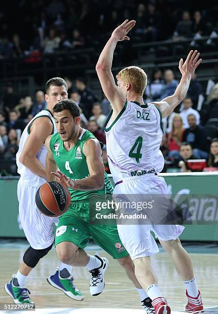 Mehmet Yagmur of Darussafaka Dogus in action against Alberto Diaz of Unicaja Malaga during Turkish Airlines Euroleague Top 16 Round 8 Basketball...