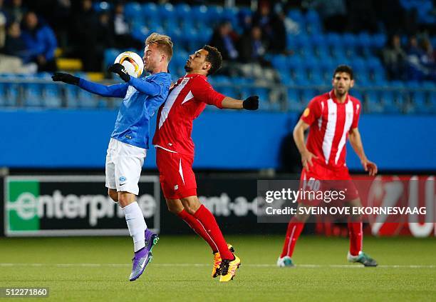 Molde's Sander Svendsen and Sevilla's French defender Timothee Kolodziejczak vie during the UEFA Europa League, Round of 32 match football between...