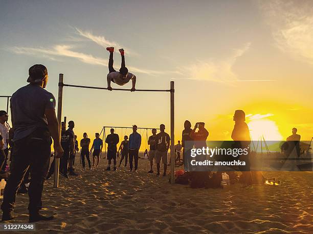 people exercising on muscle beach, santa monica - venice beach body builder stock pictures, royalty-free photos & images