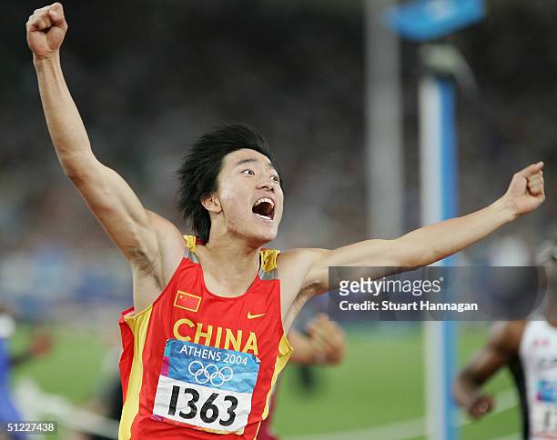 Liu Xiang of China celebrates after he finished first in the men's 110 metre hurdle final on August 27, 2004 during the Athens 2004 Summer Olympic...