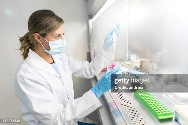 woman doing a medical test - dna test stock pictures, royalty-free photos & images