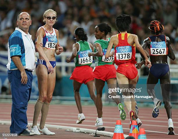 Paula Radcliffe of Great Britain looks dejected after she pulled out of the women's 10,000 metre event on August 27, 2004 during the Athens 2004...