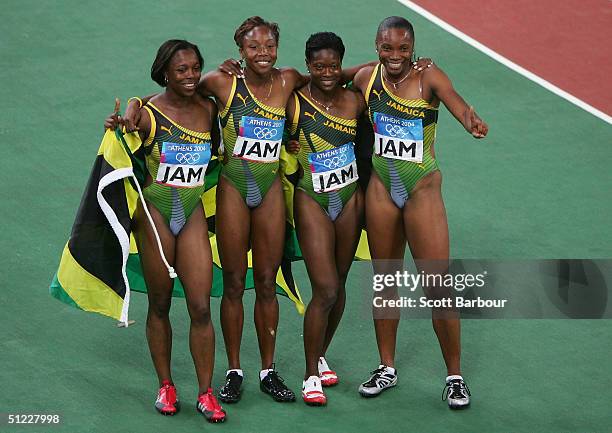 The Jamaican relay team, Veronica Campbell, Aleen Bailey, Sherone Simpson and Tayna Lawrence celebrate after Jamaica won the women's 4 x 100 metre...