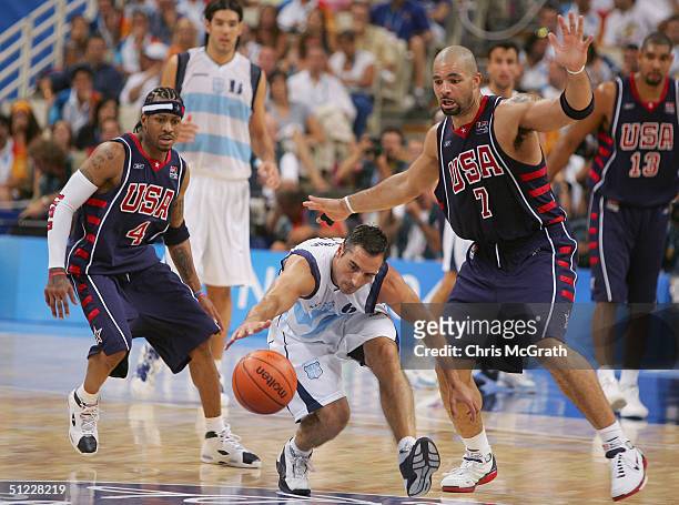 Alejandro Ariel Montecchia of Argentina dives for the ball past Allen Iverson under pressure from Carlos Boozer of United States in the men's...