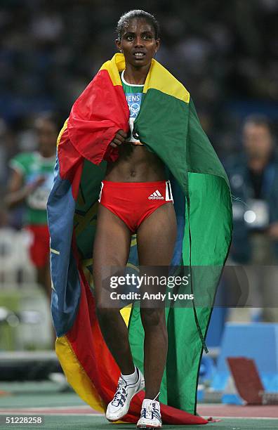 Derartu Tulu of Ethiopia celebrates after she finished third in the women's 10,000 metre event on August 27, 2004 during the Athens 2004 Summer...