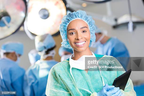 young surgeon prepares for surgery - surgery stock pictures, royalty-free photos & images