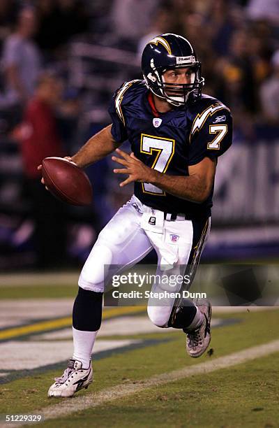 Quarterback Doug Flutie of the San Diego Chargers rolls out with the ball against the Seattle Seahawks in their preseason game on August 27, 2004 at...