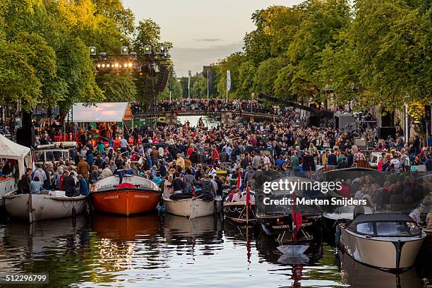 boats gathered for prinsengracht concert 2014 - amsterdam tourist stock pictures, royalty-free photos & images