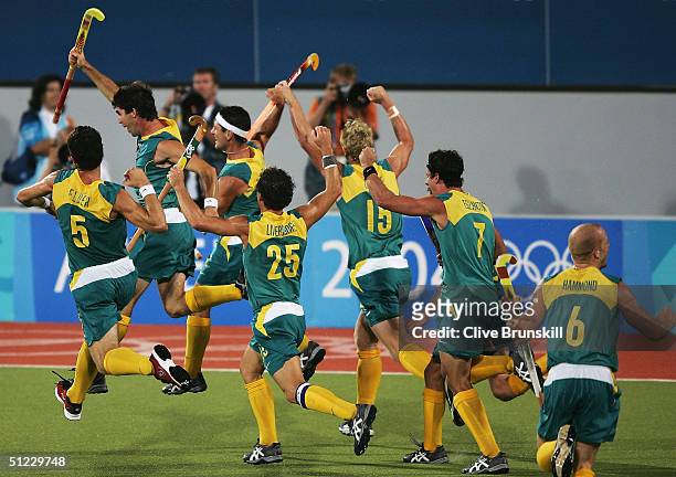 Australia celebrate their gold medal win after a Jamie Dwyer goal in extra time sealed the win in the men's field hockey event on August 27, 2004...