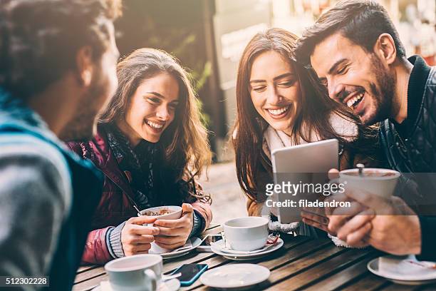 friends at the cafe - four people stock pictures, royalty-free photos & images