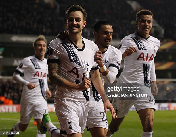 Tottenham Hotspur's English midfielder Ryan Mason celebrates scoring his team's first goal during the UEFA Europa League round of 32, second leg...