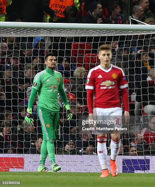 Sergio Romero and Guillermo Varela of Manchester United react to Pione Sisto Nikolay Bodurov of FC Midtjylland scoring their first goal during the...