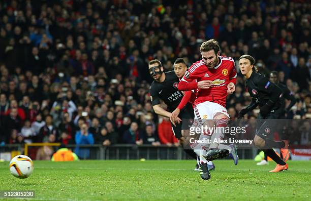 Juan Mata of Manchester United kicks the penalty saved by Mikkel Andersen of Midtjylland during the UEFA Europa League Round of 32 second leg match...
