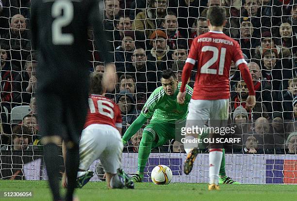 Manchester United's Argentinian goalkeeper Sergio Romero watches as a shot from FC Midtjylland's Ugandan forward Pione Sisto , goes on to score the...