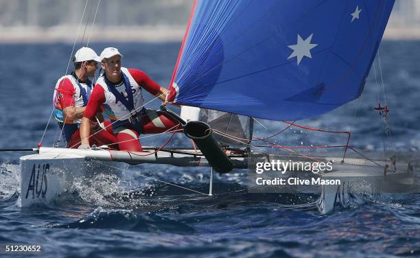 Darren Bundock and John Forbes of Australia in action in the open multihull tornado finals race on August 28, 2004 during the Athens 2004 Summer...