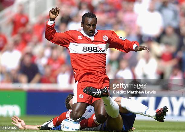 Jimmy Floyd Hasselbaink of Middlesbrough is brought down by Mark Hudson of Crystal Palace during the FA Barclays Premiership match between...