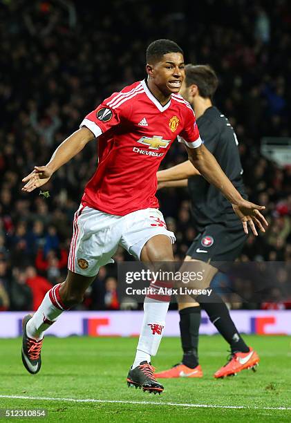 Marcus Rashford of Manchester United celebrates scoring his team's second goal during the UEFA Europa League Round of 32 second leg match between...