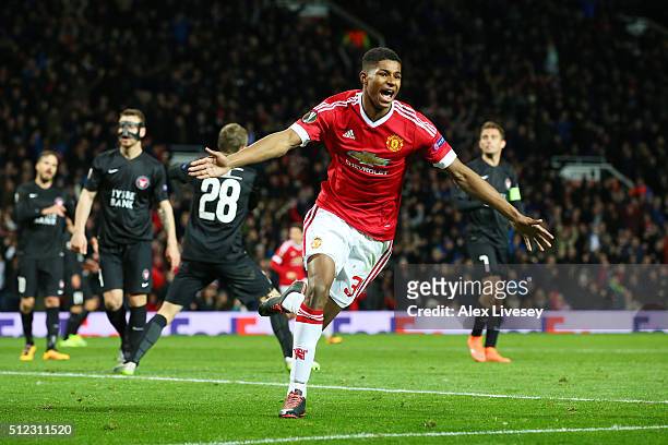 Marcus Rashford of Manchester United celebrates scoring his team's third goal during the UEFA Europa League Round of 32 second leg match between...