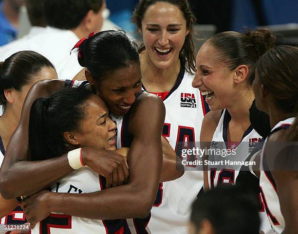 Dawn Staley, Lisa Leslie, Ruth Riley and Diana Taurasi of the United States celebrate winning the gold medal in the women's basketball gold medal...