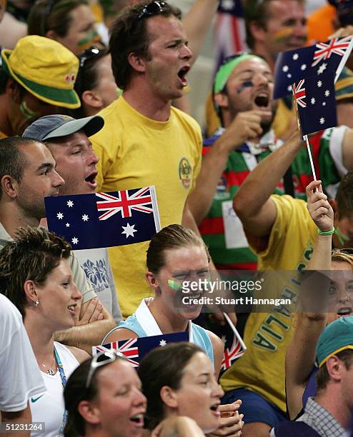 Olympic Swimmer Leisel Jones of Australia cheers on from the crowd in the women's basketball gold medal match between United States of America and...