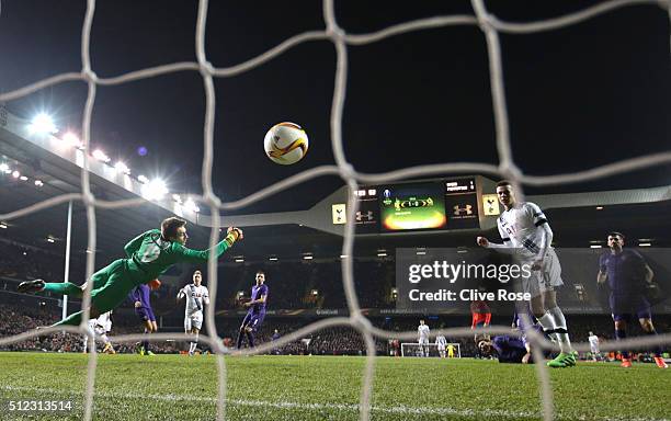 Ciprian Tatarusanu of Fiorentina dives in vain as Erik Lamela of Tottenham Hotspur scores his team's second goal during the UEFA Europa League round...