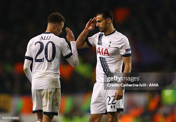 Nacer Chadli of Tottenham Hotspur and Dele Alli of Tottenham Hotspur salute each other as Alli is substituted during the UEFA Europa League match...