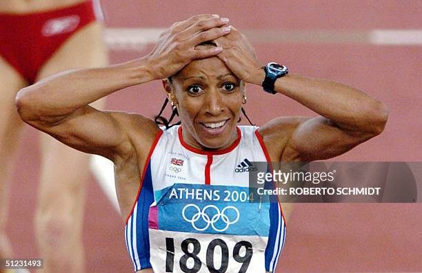 Britain's Kelly Holmes reacts after winning the gold in the women's 1,500m final at the Olympic Stadium 28 August 2004 during the Olympic Games...