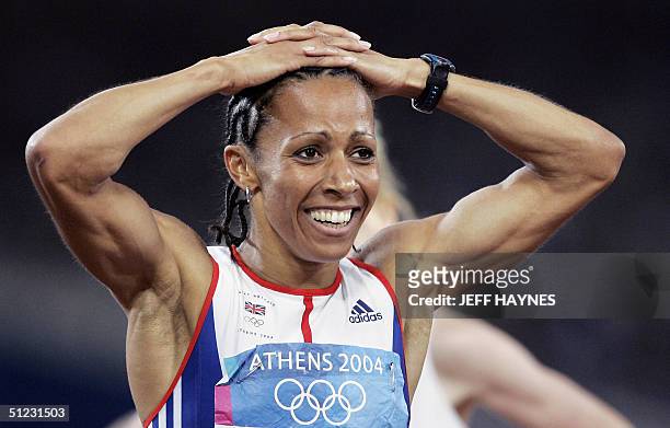 Britain's Kelly Holmes reacts after winning the gold in the women's 1,500m final at the Olympic Stadium 28 August 2004 during the Olympic Games...