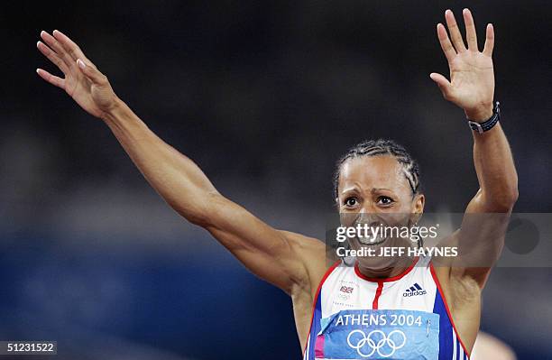 Britain's Kelly Holmes reacts after winning the bronze in the women's 1,500m final at the Olympic Stadium 28 August 2004 during the Olympic Games...