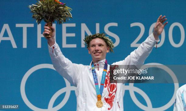 Gold medalist Alexei Tichtchenko of Russia stands on the podium during the awards ceremony of the Olympic Games featherweight boxing competition 28...