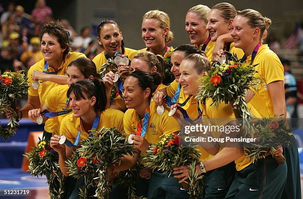 Team Australia hold their silver medals during the medal ceremony after receiving the gold medal for women's basketball during ceremonies on August...