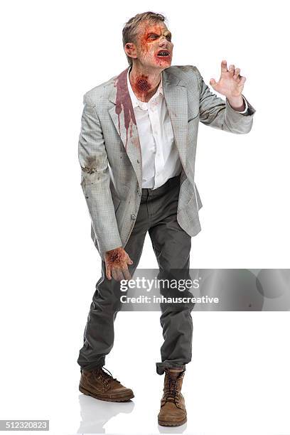 zombie walking and reaching - zombie stock pictures, royalty-free photos & images