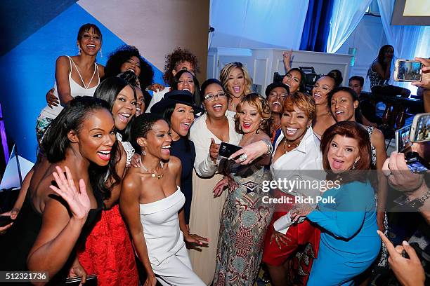 Oprah Winfrey poses with guests during the 2016 ESSENCE Black Women In Hollywood awards luncheon at the Beverly Wilshire Four Seasons Hotel on...