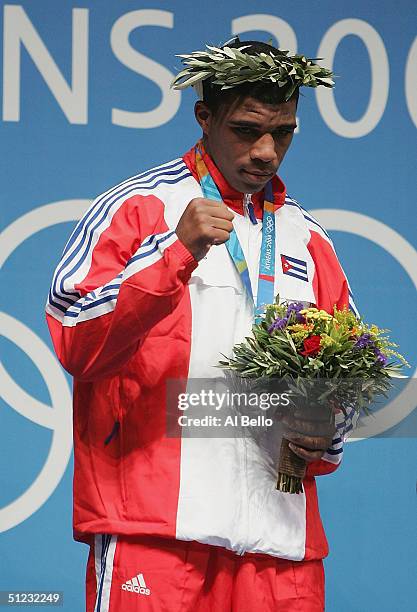 Odlanier Solis Fonte of Cuba receives the Gold medal at the medal ceremony for the men's boxing 91kg event on August 28, 2004 during the Athens 2004...