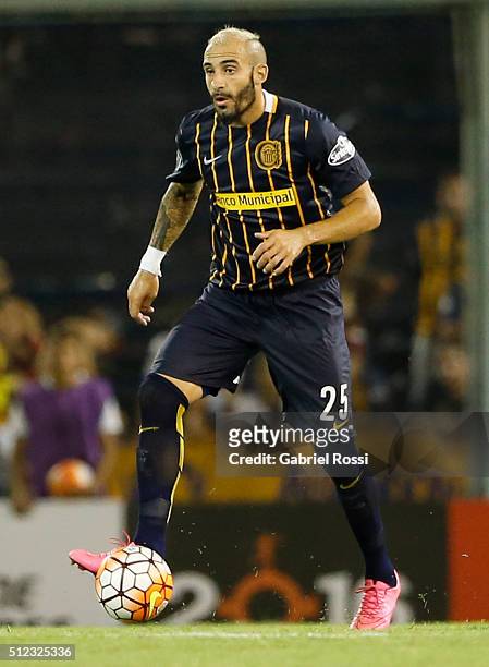 Javier Pinola of Rosario Central drives the ball during a group stage match between Rosario Central and Nacional as part of Copa Bridgestone...