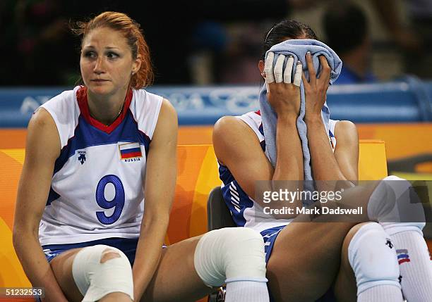 Elizaveta Tishchenko and Ekaterina Gamova of Russia sit on the bench after losing to China in the women's indoor Volleyball gold medal match on...
