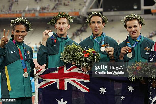 John Steffensen, Patrick Dwyer, Mark Ormrod and Clinton Hill of the Australian relay team pose with their silver medals during the men's 4 x 400...