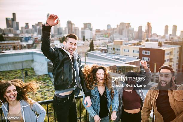 group of friends in seattle city setting - seattle city life stock pictures, royalty-free photos & images