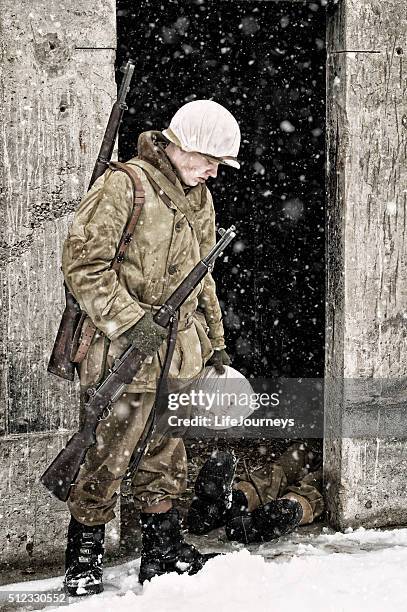 wwii us infantry soldier - death of his comrad - serious injury stock pictures, royalty-free photos & images