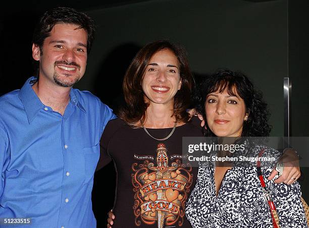 Producer Greg Spotts, guest Alessandra Amadeo and Spotts' wife Mojgan Khalpari attend the "American Jobs" premiere at the Laemmle Fairfax Theater on...