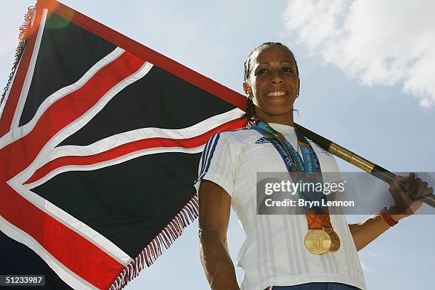 Olympic 800m and 1500m Champion Kelly Holmes of Great Britain, who will carry the British flag at the Athens 2004 closing ceremony, poses with her...