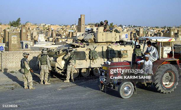 Troops seal off the Valley of Peace cemetery in the Shiite holy city of Najaf 28 August 2004. The cemetery -- the largest in the world -- was the...