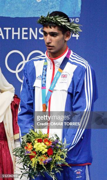 Silver medalist Amir Khan of Great Britain stands during the Olympic Games awards ceremony for the lighweight boxing competition 29 August 2004 at...