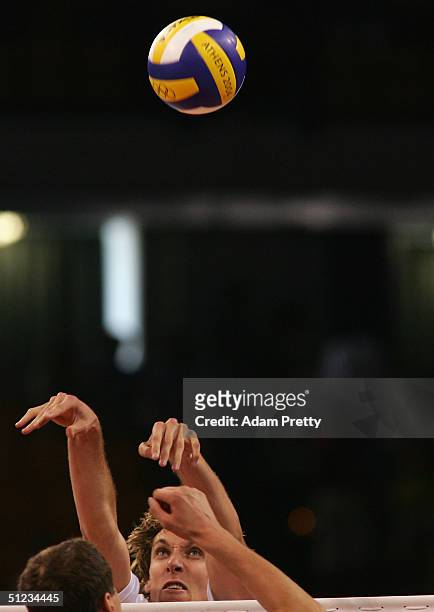 Ryan Millar of the United States spikes the ball against Russia during the men's indoor Volleyball bronze medal match against the United States on...