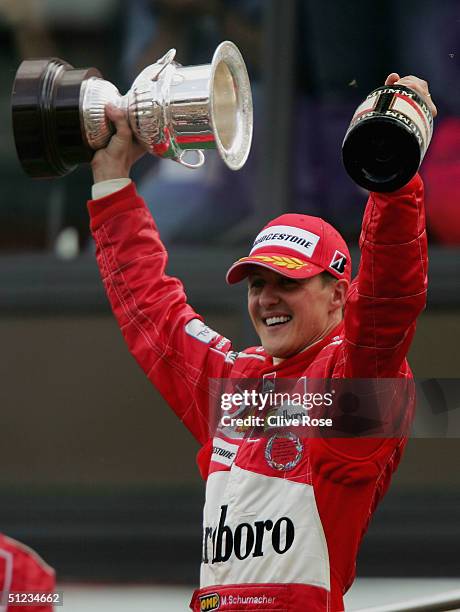 Michael Schumacher of Germany and Ferrari celebrates after winning the World Championship after coming third in the Belgium F1 Grand Prix at the...